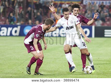 CLUJ-NAPOCA, ROMANIA - OCTOBER 2: Ivo Pinto, van Persie and Aguirregaray in UEFA Champions League match between CFR 1907 Cluj and Manchester United, on 2 Oct., 2012 in Cluj-Napoca, Romania