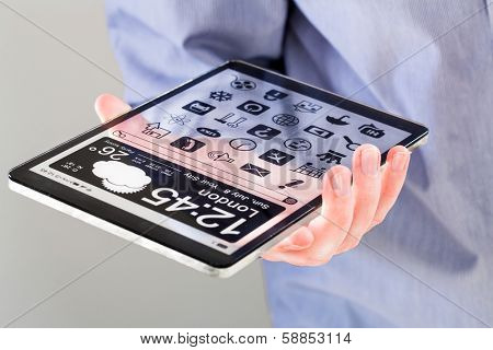 Tablet with a transparent display in human hands. Concept actual future innovative ideas and best technologies humanity.