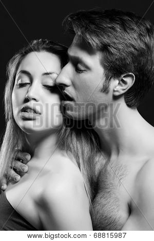 lowkey B and W portrait of a passionate couple