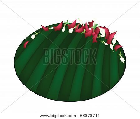 Corolla Of Roses And Jasmines On Banana Leaf