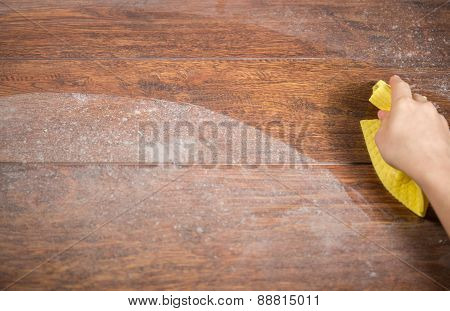 Wiping Dusty Wood Using Rag
