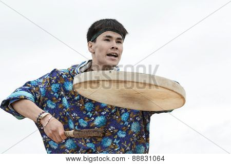 Emotional man dancer dancing with a tambourine. Kamchatka, Russia