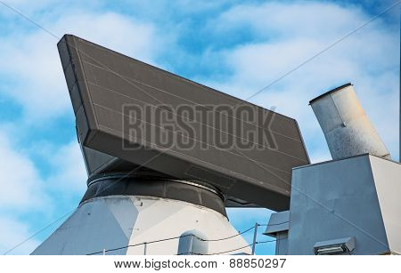 Close-up view of radar on naval ship.