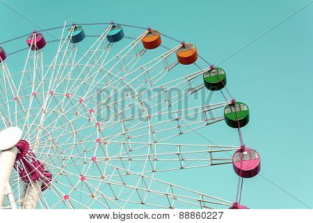 Giant Ferris Wheel Against Blue Sky