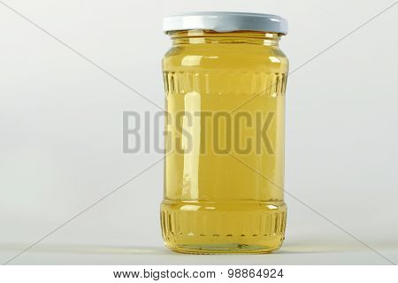 Honey Jar. Honey Tidbit In Glass Jar And Honeycombs Wax.