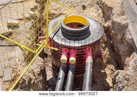 Excavation Pit, Electrical Cables And Optical Fibres In The Digging On A Construction Site