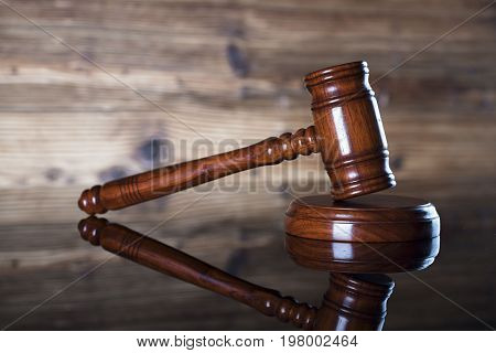 Auction and business concept.  Gavel on the wooden background.