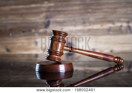 Gavel. Auction and business concept. Wooden background.