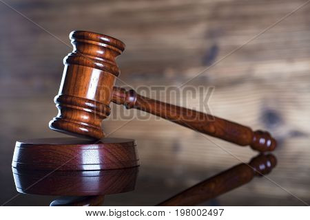 Gavel. Auction and business concept. Wooden background.