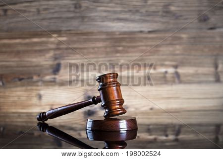Gavel. Auction and business concept. Wooden background.