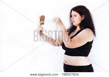 Young Overweight Woman Putting Measuring Tape Around Ice Cream B