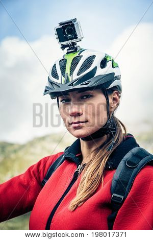 Female Mountain biker with Actioncam mounted on Helmet.