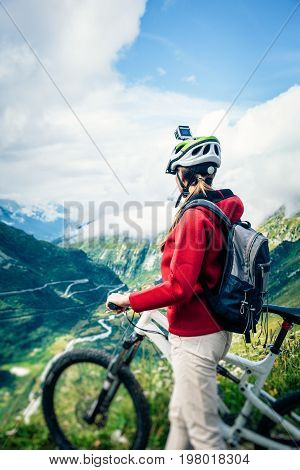 Female Mountain biker with Actioncam mounted on Helmet.