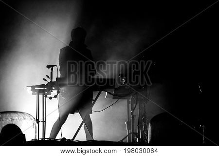 Silhouette Of A Keyboardist In Stage Lights