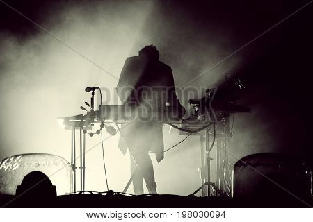 Silhouette Of A Keyboardist In Stage Lights