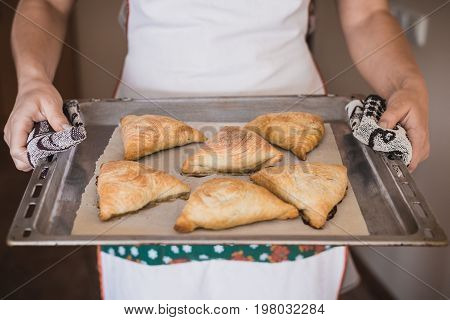 Uzbek National Cuisine. Samsa On A Tray, In Female Hands. Horizontal Frame