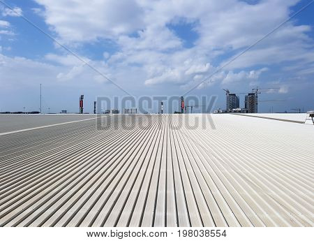 1 August 2017 Muangthong Thani Thailand ; Roof of metal sheet building with clear blue sky background