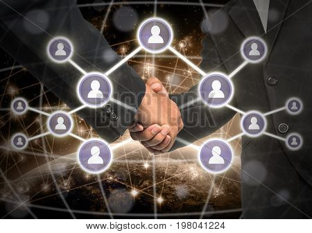 Business handshake with Social media symbol over Internet network concept background Elements of this image furnished by NASA Business social netwok concept