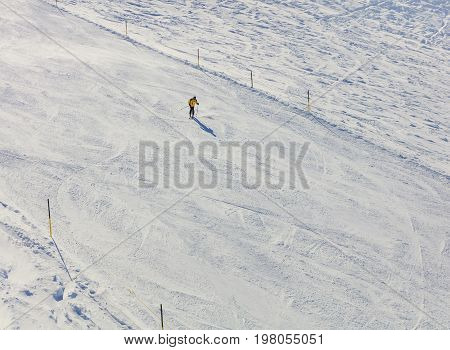 Mt. Titlis, Switzerland - 9 March, 2016: a person skiing on Mt. Titlis. The Titlis is a mountain located on the border between the Swiss cantons of Obwalden and Bern, mainly accessed from the town of Engelberg on the northern side.