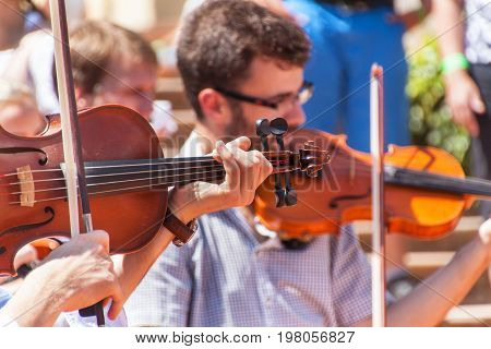 Buchlovice Czech Republic July 29 2017: Man playing the violin at folk festivals in the castle Buchlovice . Traditional farmers harvest celebrations of garlic.