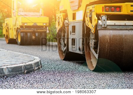 Background Of Asphalt Roller That Stack And Press Hot Asphalt. Road Repair Machine