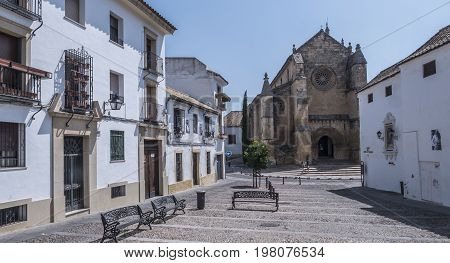 Cordoba, SPAIN - July 9, 2017: Church of Santa Marina, catholic temple site in the city of Cordoba, it is placed opposite to the monument to the toreador Manolete, Andalusia, Spain