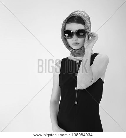 beautiful young woman in retro style with her hair in little black dress