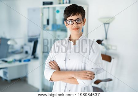 Portrait of female optometrist at eyesight medical ophthalmology clinic