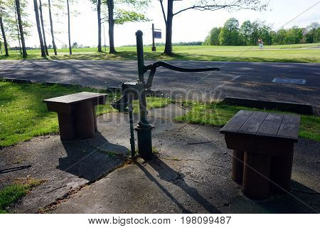 FIFE LAKE, MICHIGAN / UNITED STATES - MAY 27, 2017: The Michigan Department of Transportation Roadside Park, honoring J. Charles Brown, on U.S. Highway 131, offers a pump where motorist may obtain potable well water.