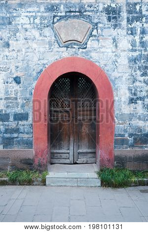 Chinese old traditional door and brick wall, Luodai, China