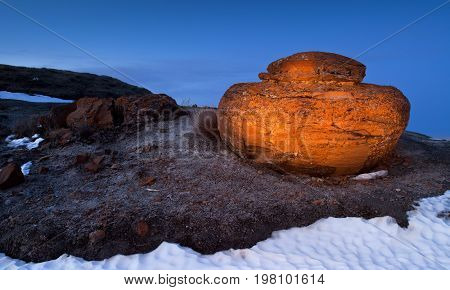 Unusual round red boulders in Red Rock Coulee in Southern Alberta, Canada.