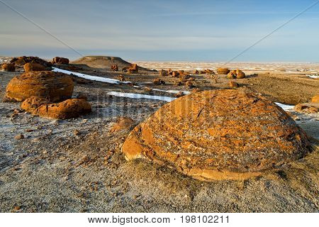 Unusual round red boulders in Red Rock Coulee in Southern Alberta, Canada.