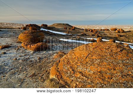 Unusual round red boulders in Red Rock Coulee in Southern Alberta, Canada.