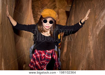 Tourist Young Woman Wearing Hat Enjoying The Walk Up The Stairs On The Mountain.
