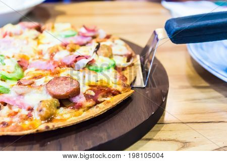 Delicious homemade slice pizza on the table.