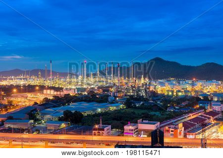 Oil refinery plant and illuminated at twilight.