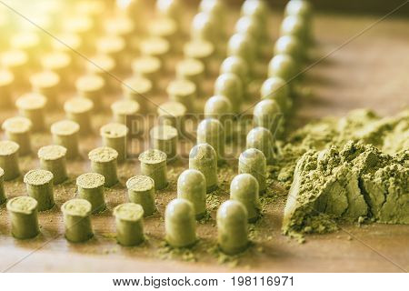 Kariyat Organic drued green herbal drug an alternative medicine with capsule packing tool.