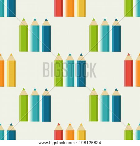 Seamless pattern with a set of colored pencils isolated on a white background
