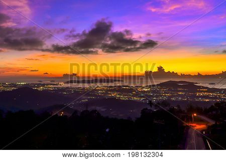 Kota Kinabalu city in a mountain valley and the beautiful sunset view from Kokol Hill,Inanam,Sabah,Borneo,Malaysia.Kokol Hill is a famous place for tourist to visit with the best view of Kota Kinabalu city.