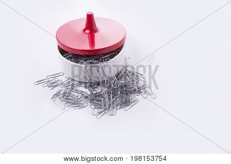 Full bowl of paper clips on the white background