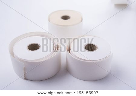 Three blank roll paper for cashiers on white background