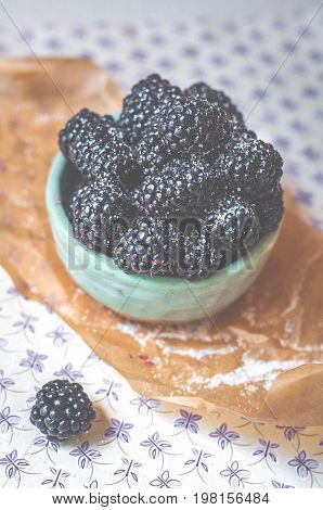 Homemade, sweet, delicious blackberries in a handmade dish