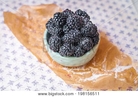 Homemade, sweet, delicious blackberries in a handmade dish