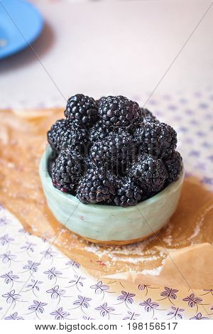 Homemade, sweet, delicious blackberries in a handmade dish