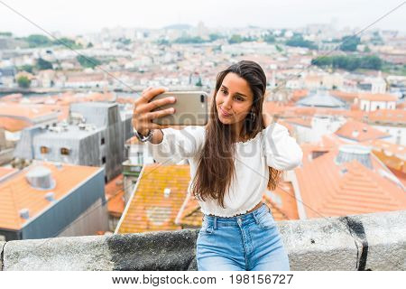 Young Beautiful Woman Tourists Take Selfie In View Point Of Porto, Portugal