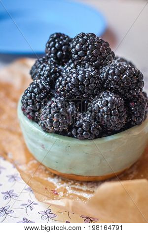 Homemade, sweet, delicious blackberries in a handmade dish