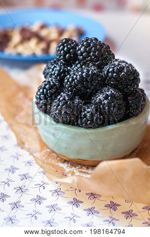Homemade, sweet, delicious blackberries in a handmade dish