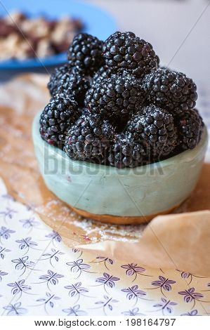 Homemade, sweet, delicious blackberries in a handmade dish