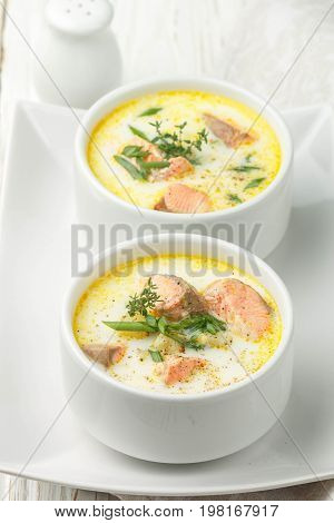 Creamy fish soup with salmon potatoes onions and carrots. Kalakeitto. Traditional dish of the Finnish cuisine