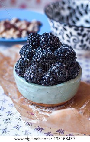 Homemade, sweet, delicious blackberries in a handmade dish